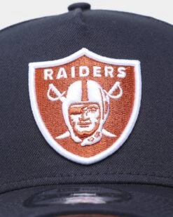 New Era Las Vegas Raiders 9FORTY A-Frame Snapback Navy/Rust 7 New Era Las Vegas Raiders 9FORTY A-Frame Snapback Navy/Rust -Mitchell & Ness Shop 196175767227 default 0050