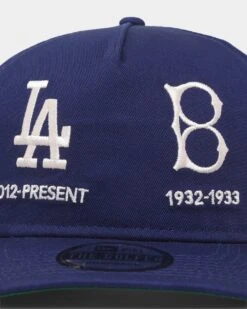 New Era Los Angeles Dodgers 'Logo Evolution' Golfer Snapback Golfer Collection Dark Royal 7 New Era Los Angeles Dodgers 'Logo Evolution' Golfer Snapback Golfer Collection Dark Royal -Mitchell & Ness Shop 196500152209 default 0050