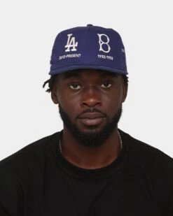 New Era Los Angeles Dodgers 'Logo Evolution' Golfer Snapback Golfer Collection Dark Royal 9 New Era Los Angeles Dodgers 'Logo Evolution' Golfer Snapback Golfer Collection Dark Royal -Mitchell & Ness Shop 196500152209 mens 0100