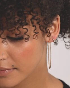 Raising Hell Women's 2mm Iced Huggie Earring Iced Gold -Mitchell & Ness Shop 4454569768349 womens 00030